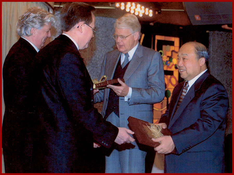Mr. Shi Guangsheng, Minister of Foreign Trade of China receiving the Chinese book