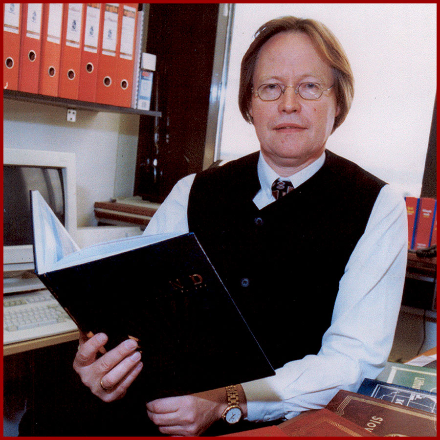 Halldór Pálsson in his office, reading a book
